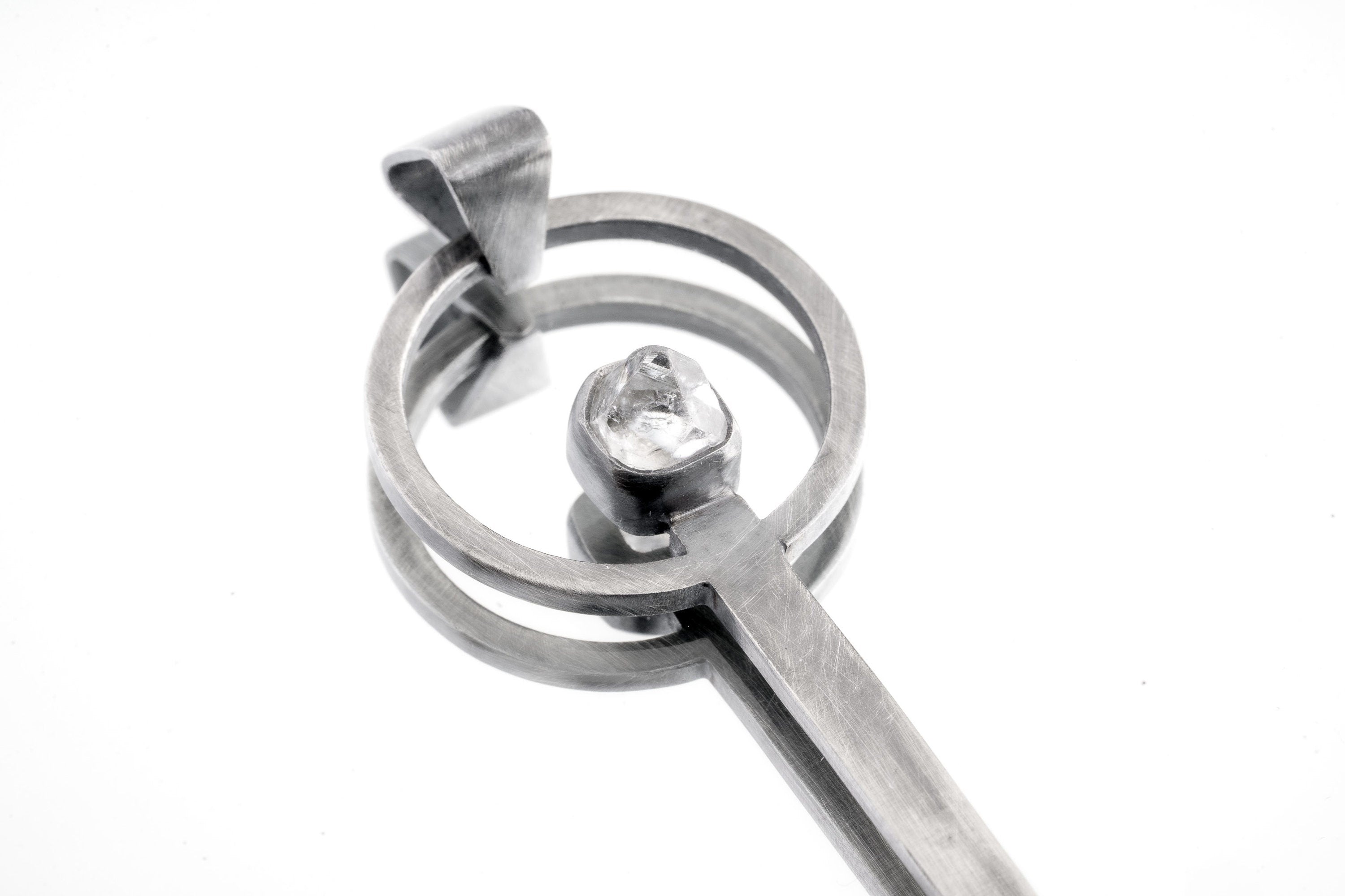 Himalayan Laser Quartz spoon pendant shown close-up with solid 925 sterling silver and clear pointed crystal.