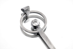 Himalayan Laser Quartz spoon pendant shown close-up with solid 925 sterling silver and clear pointed crystal.