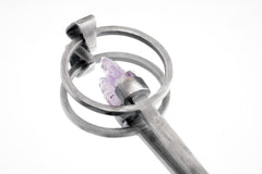 Close-up of Twin Vera Cruz Amethyst spoon pendant showing brush-textured silver and delicate twin crystal setting.
