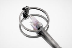 Close-up of Vera Cruz Amethyst spoon pendant showing brush-textured silver and delicate double terminated crystal setting.