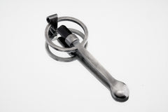 Black Tourmaline spoon pendant shown on white background with solid 925 sterling silver and dark crystal detail.