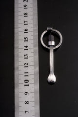 Black Tourmaline sterling silver spoon pendant shown beside a ruler for scale with solid cast silver body.