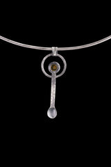 Mexican Amber fairy spoon shown on a choker with dark background and small handmade ritual spoon form.