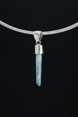 Aqua Aura Quartz Amethyst pendant shown on black background with high-shine 925 sterling silver setting and blue crystal point.