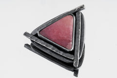 Heart Triad Rhodochrosite pendant shown on white background with pink stone and oxidized silver triangle frame.