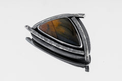 Tiger’s Triad Pendant shown on white background with golden-brown Tiger Eye and oxidized silver triangle frame.