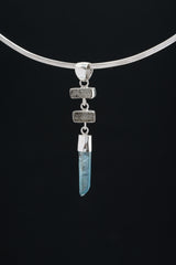 Black Rutile Quartz and Lemurian Aqua Aura pendant displayed on dark background with high-shine sterling silver.