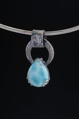 Blue Moonstone Larimar Heirloom Pendant shown on black background with large bail and oxidized silver setting.