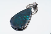 Raw Moonstone Chrysocolla pendant on white background with oxidized sterling silver claw setting and large circular bail.