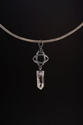 Himalayan Lemurian Quartz Blue Moonstone sphere pendant shown on black cord, with oxidized sterling silver wire sphere.