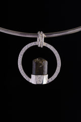 Sterling silver circular halo pendant with Dravite Tourmaline set point-up inside.