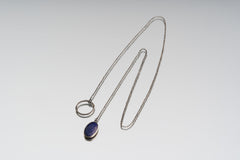 Full view of Faceted Lapis Lazuli adjustable necklace showing 32 inch sterling silver chain and textured ring closure.