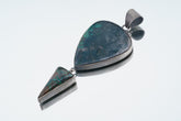 Malachite Pyrite Chrysocolla Azurite sterling silver pendant shown on white background with chain.