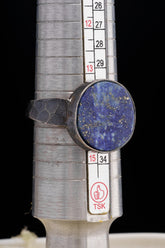 Old cut Lapis Lazuli ring shown beside a ruler for scale, with heavy oxidized 925 sterling silver construction.