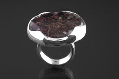 Front view of Ruby Mica Quartz Matrix ring showing red mineral inclusions, polished silver, and bold oval stone setting.