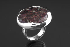 Side view of Ruby in Mica and Quartz Matrix ring showing waved bezel, textured sterling silver band, and raised setting.