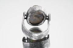 Back view of Mystic Oculus Labradorite ring showing U-shaped band, oxidized texture, and sculptural silver construction.