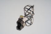 Himalayan Brown Tourmaline and Ethiopian Opal sphere pendant in oxidized 925 sterling silver, shown with Brutalist wire construction.