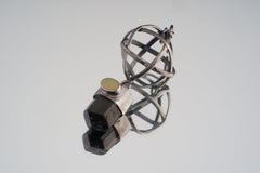 Himalayan Brown Tourmaline and Ethiopian Opal sphere pendant in oxidized 925 sterling silver, shown with Brutalist wire construction.