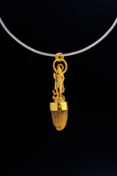Shiva cow horn pendant displayed on black background with 24k gold-plated finish and spiritual talisman design.
