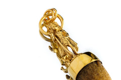 Detailed view of gold-plated Shiva pendant showing sculptural figure, circular bail, and handmade chain detail.