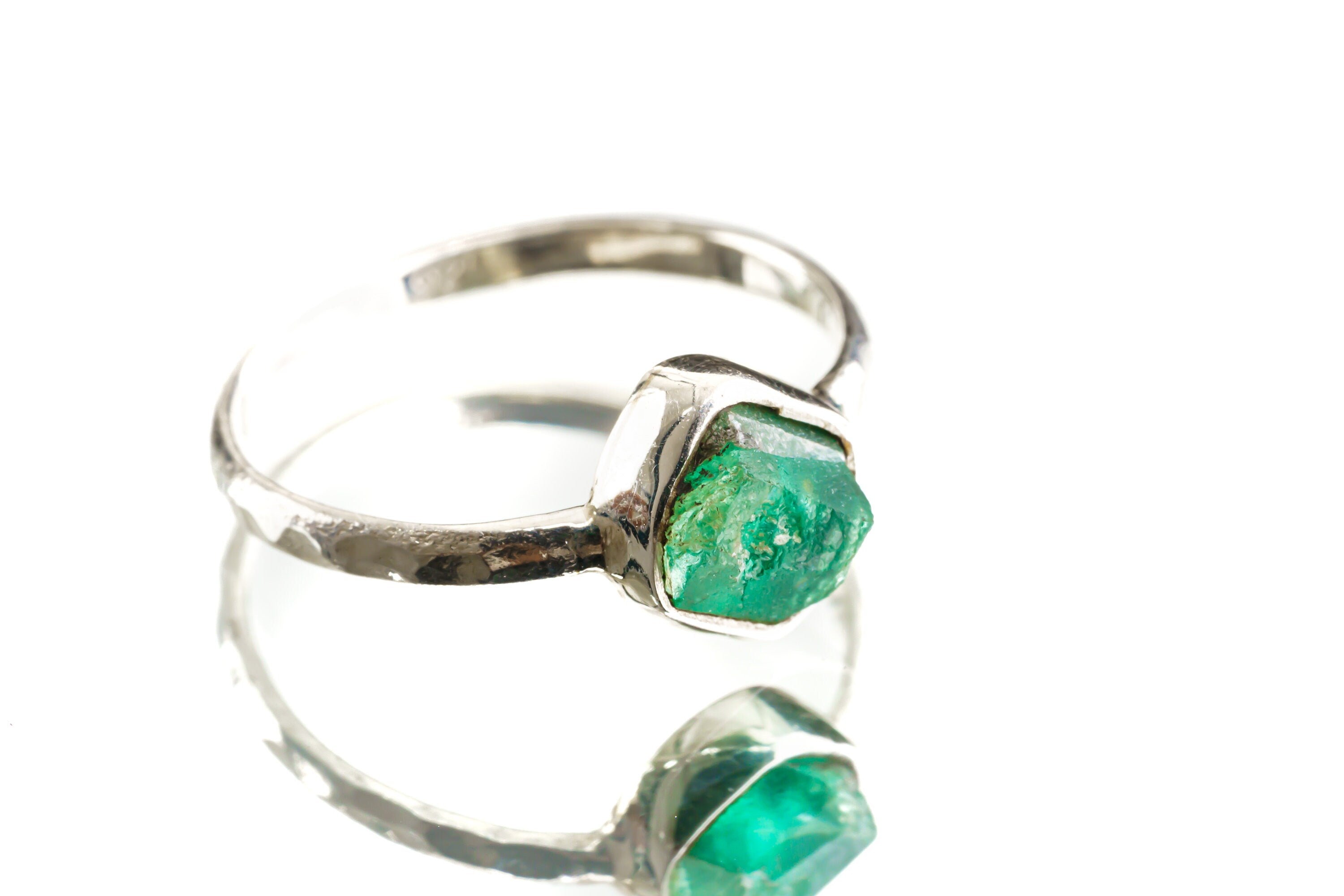 Australian Raw Emerald sterling silver stack ring shown on a light background, with green gemstone and hammered band.