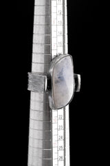 Rectangular Moonstone ring shown beside a ruler for scale, with oxidized 925 sterling silver and brutalist band profile.