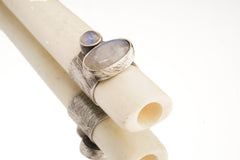 Blue Moonstone antique bone pendant shown from the side, highlighting hollow tube form and polished silverwork.