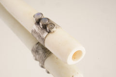 Blue Moonstone antique bone pendant shown from the side, highlighting hollow tube form and handmade silverwork.