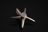 Blue Moonstone starfish charm shown on black cord, with polished 925 sterling silver and small ocean-inspired shape.