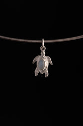 Blue Moonstone starfish charm shown on black cord, with polished 925 sterling silver and small ocean-inspired shape.