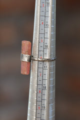 Pink Tourmaline ring shown beside a ruler for scale with 3 mm half-round sterling silver band.