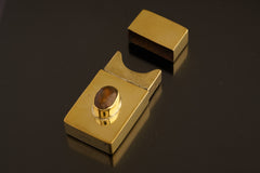 Polished brass keepsake box shown open with tight-fitting lid, curved notch, and functional matchbox-style construction.