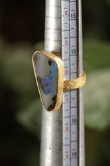Opal adjustable ring shown beside a ruler for scale, with textured 18k gold-plated 925 sterling silver band.