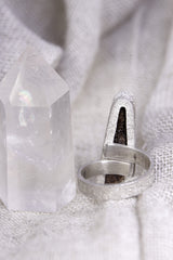 Back view of Opal adjustable ring showing the open band and pierced sterling silver support plate beneath the stone.