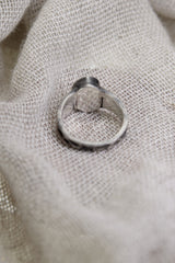 Back view of Lightning Ridge Opal sterling silver ring showing the circular band and handmade textured silver profile.