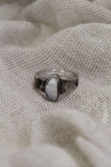 Front view of handmade 925 sterling silver Lightning Ridge Opal ring with bezel setting and natural Australian Opal colour play.