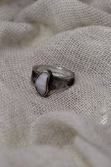 Side profile of handmade sterling silver Opal ring showing the raised bezel setting, textured band, and natural Lightning Ridge Gem Opal.