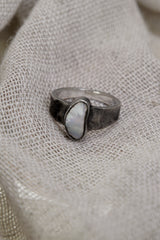 Lightning Ridge Gem Opal ring in handmade sterling silver, shown from the side with textured band detail and pale rainbow opal colour.