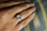 Handmade 925 sterling silver Lightning Ridge Opal ring shown worn on the hand, with a textured silver band and natural Opal centre stone.