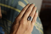 Vera Cruz Amethyst adjustable ring in oxidized 925 sterling silver shown worn on the hand with brushed texture.