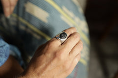 Mount Darwin Tektite Hollow Silver Ring shown worn as a bold sterling silver statement ring with cosmic impact glass.