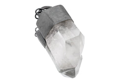 Clear Quartz pendant on white background with high-shine sterling silver halo frame and natural crystal point.
