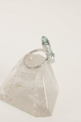 Aqua Aura Quartz silver ring shown from the side, highlighting the pointed crystal and rugged oxidized setting.