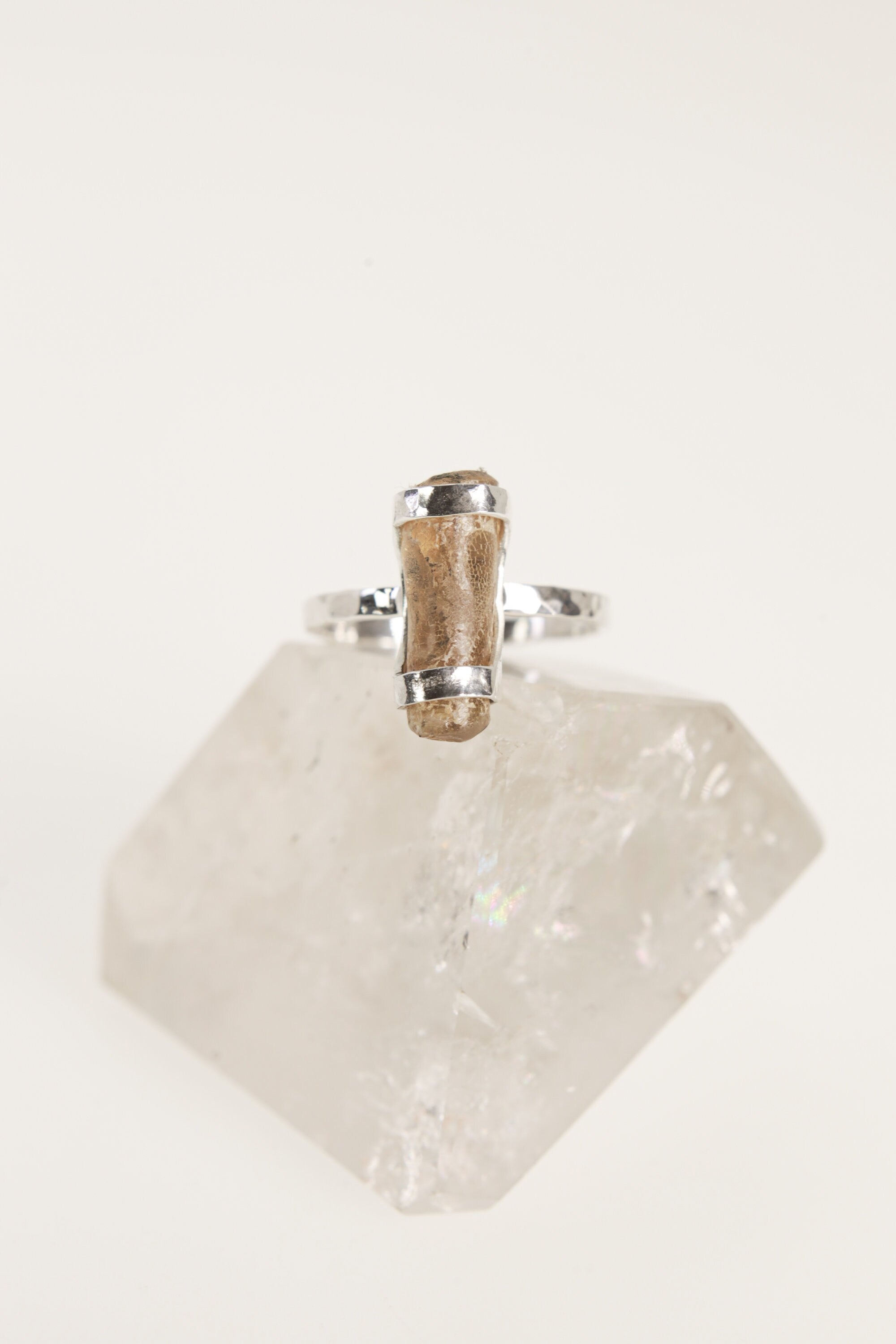 Front view of handmade Amber fossil ring showing the honey-gold organic stone and secure sterling silver setting.
