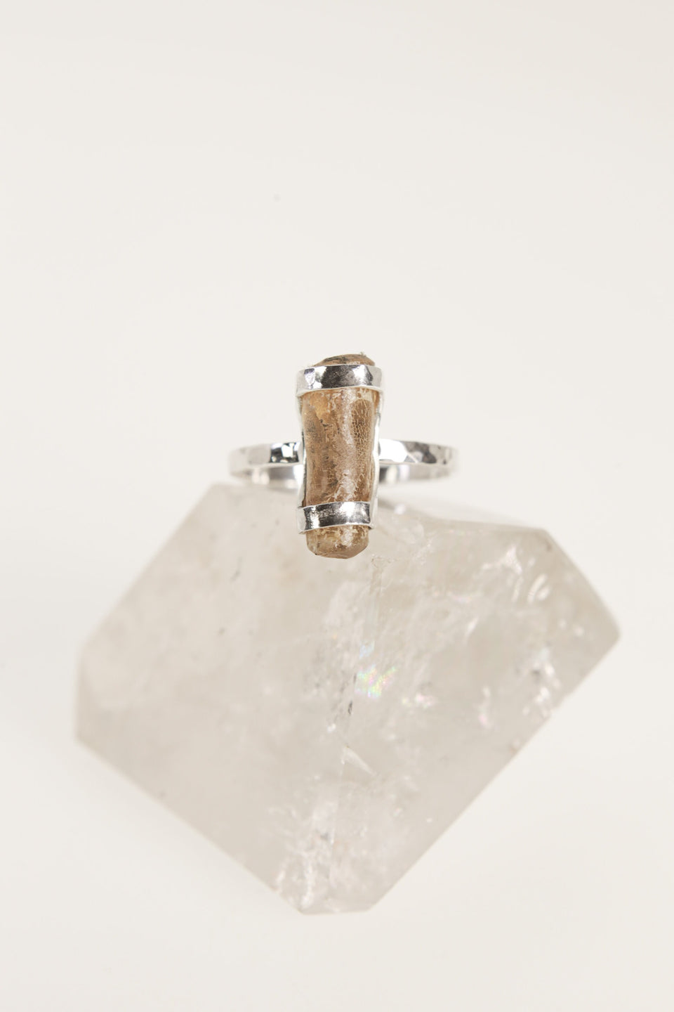 Front view of handmade Amber fossil ring showing the honey-gold organic stone and secure sterling silver setting.