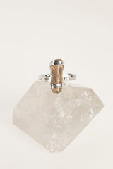 Front view of handmade Amber fossil ring showing the honey-gold organic stone and secure sterling silver setting.