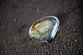 Teardrop Labradorite adjustable ring in high-shine 925 sterling silver shown close-up with blue-green and gold flash.