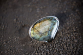 Teardrop Labradorite adjustable ring in high-shine 925 sterling silver shown close-up with blue-green and gold flash.