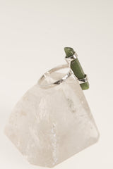 Australian Jade ring displayed on clear quartz, with oxidized sterling silver setting and lush green gemstone.